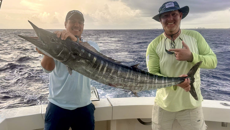 Sneak in a big wahoo between rain drops!